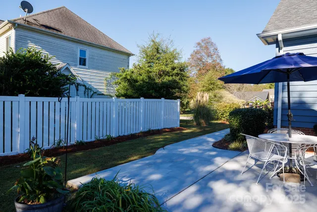 a view of a backyard with sitting area