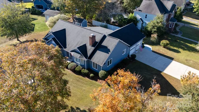 an aerial view of a house having yard
