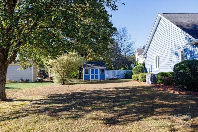 a view of a house with a small yard