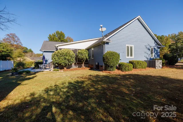 a view of a house with a flower garden