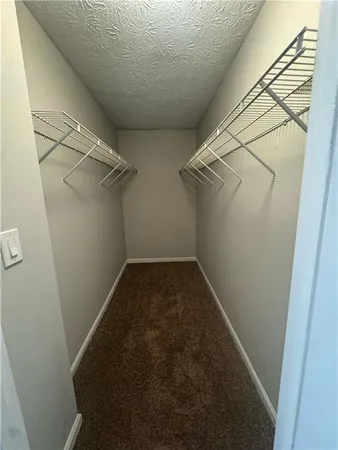 a view of a room with racks on the wall