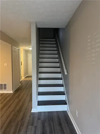 a view of entryway with wooden floor