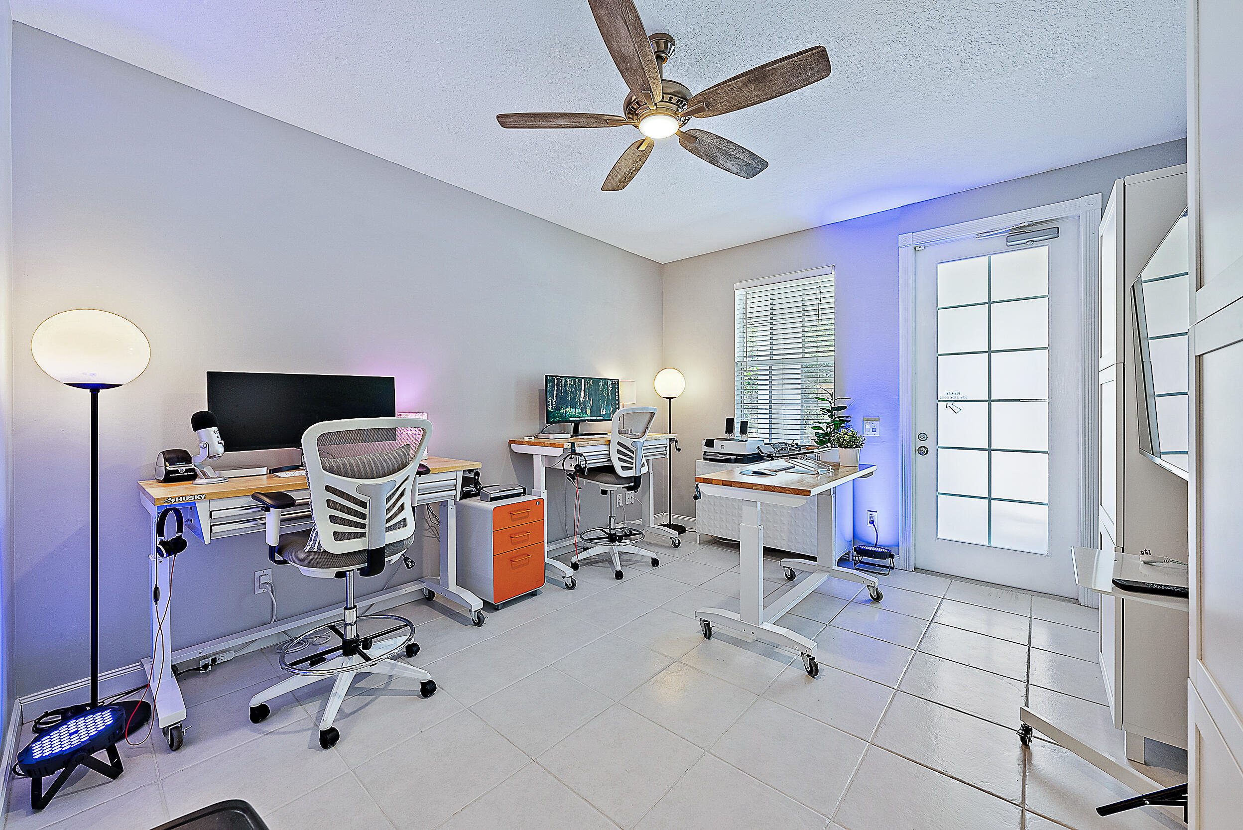 107 Rivinia Drive Jupiter, FL 33458 - Photo 12 of 28 a view of a workspace with a window and lounge chair
