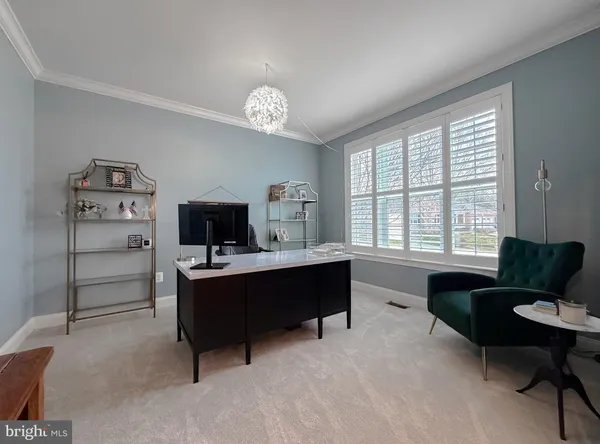 a kitchen with stainless steel appliances granite countertop a refrigerator a stove a sink a oven and a dining table