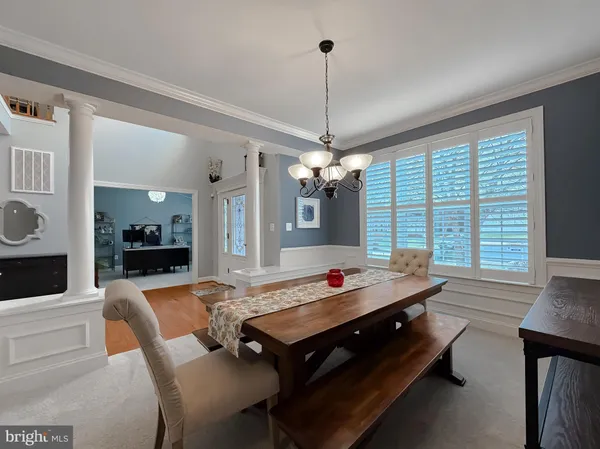 a living room with furniture fireplace and a window