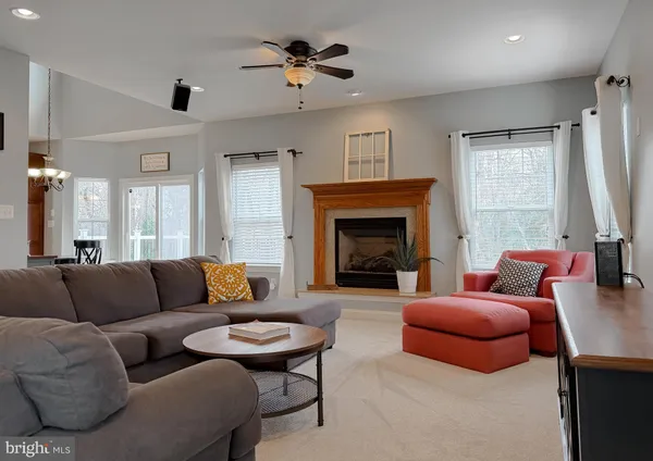 a kitchen with stainless steel appliances granite countertop a refrigerator stove and sink
