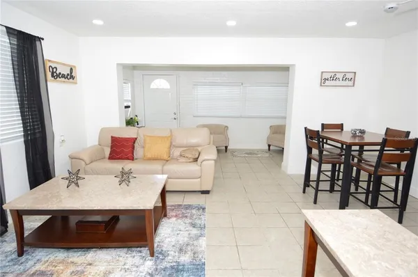 a living room with furniture and a table