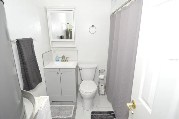 a bathroom with a toilet and a sink