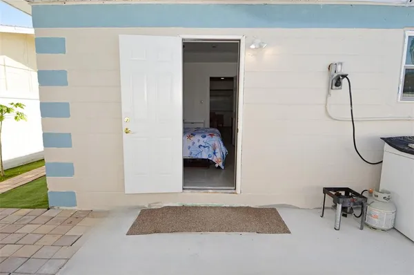 a bedroom with a bed and a mirror