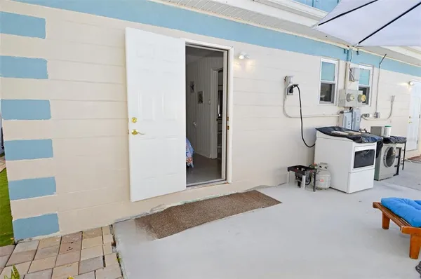 a view of a two chairs in the patio