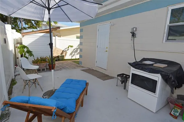 a view of a pathway of a house with backyard