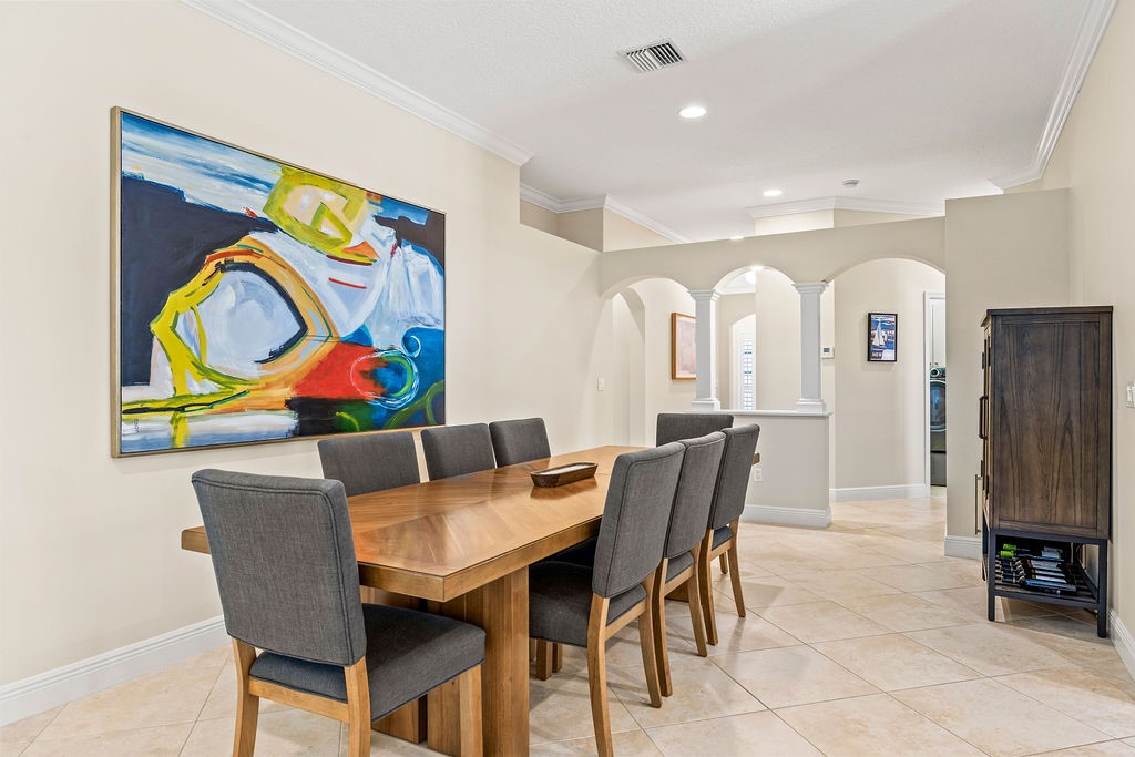 2134 Northwest Tilia Trail Stuart, FL 34994 - Photo 12 of 36 a view of a dining room with furniture