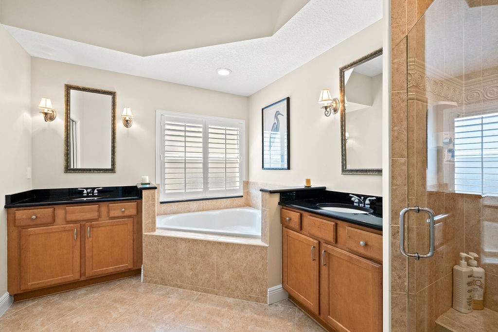 2134 Northwest Tilia Trail Stuart, FL 34994 - Photo 18 of 36 a kitchen with granite countertop a sink and cabinets