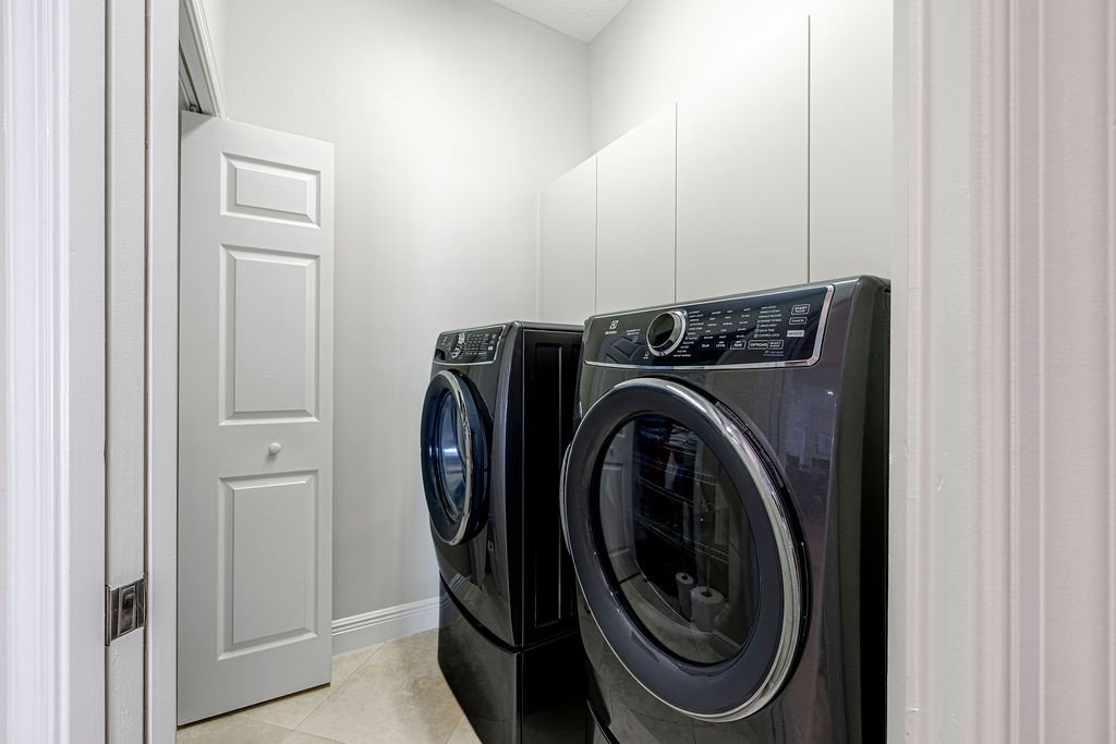 2134 Northwest Tilia Trail Stuart, FL 34994 - Photo 20 of 36 a utility room with dryer and washer