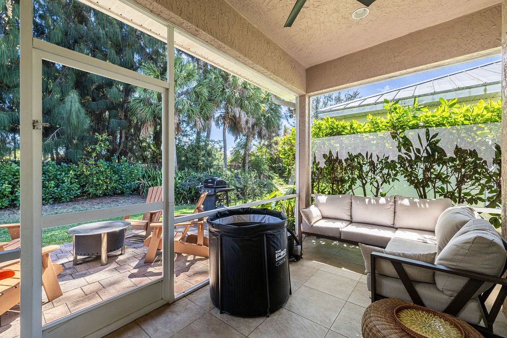 2134 Northwest Tilia Trail Stuart, FL 34994 - Photo 24 of 36 a living room with a couch and a table