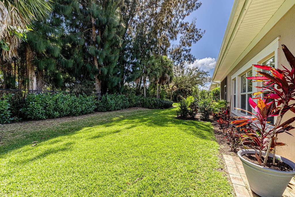 2134 Northwest Tilia Trail Stuart, FL 34994 - Photo 26 of 36 a view of swimming pool with a garden