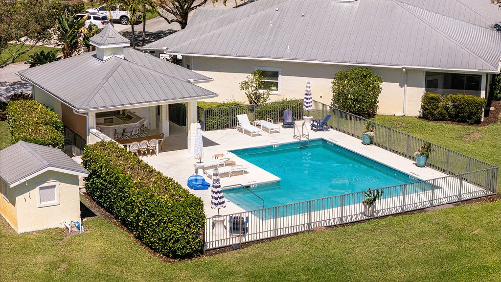 2134 Northwest Tilia Trail Stuart, FL 34994 - Photo 34 of 36 a view of a house with backyard and sitting area