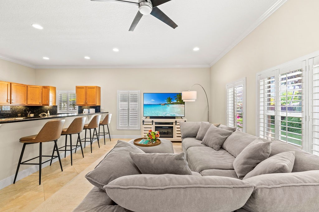 2134 Northwest Tilia Trail Stuart, FL 34994 - Photo 4 of 36 a living room with furniture and a large window
