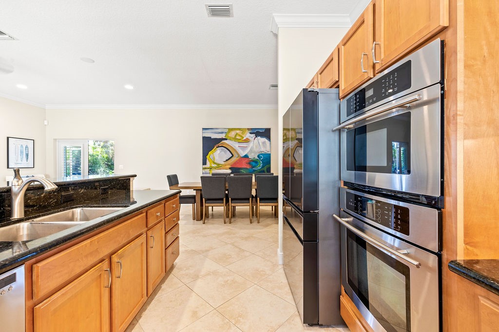 2134 Northwest Tilia Trail Stuart, FL 34994 - Photo 8 of 36 a view of a hallway with furniture