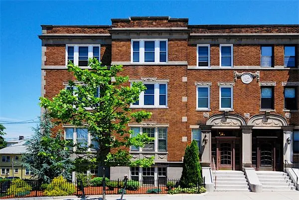 a front view of a multi story residential apartment building
