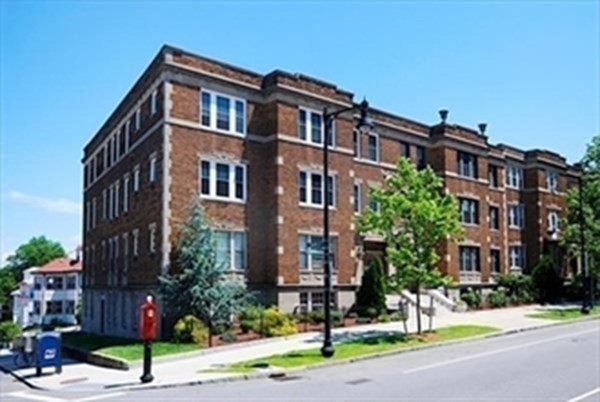 2025 Commonwealth Avenue, Unit 5 Boston, MA 02135 - Photo 12 of 13 a front view of a multi story building