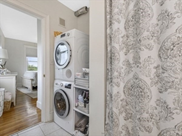 2025 Commonwealth Avenue, Unit 5 Boston, MA 02135 - Photo 9 of 13 a view of bathroom with washer and dryer