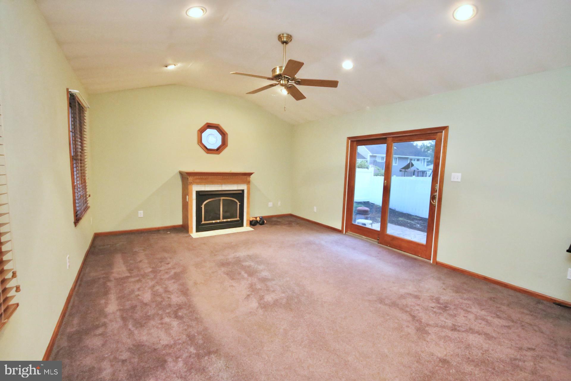 1017 West Front Street Glendora, NJ 08029 - Photo 16 of 34 Cathedral ceiling and gas fireplace.