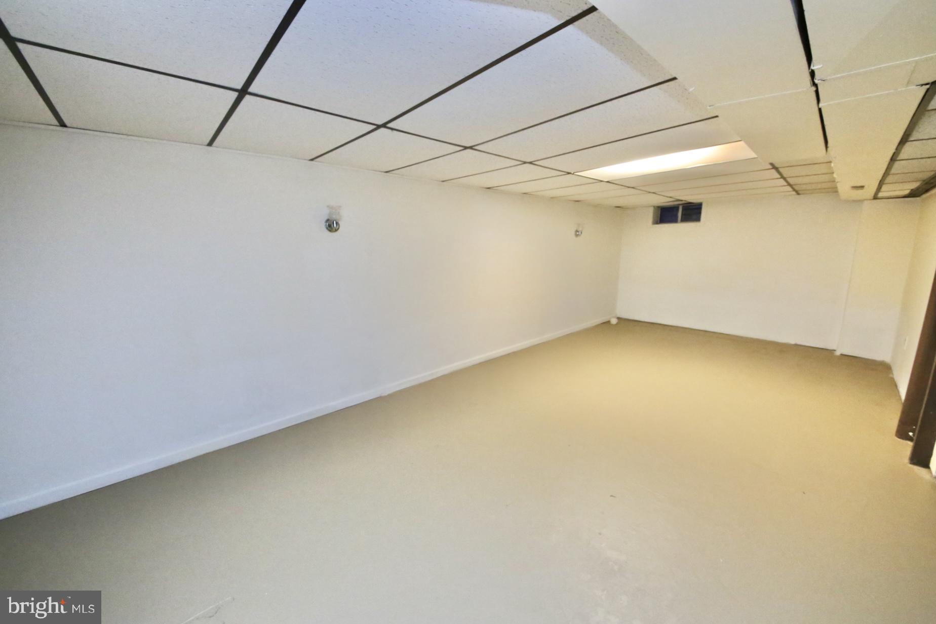 1017 West Front Street Glendora, NJ 08029 - Photo 30 of 34 Large finished basement has sump pumps.