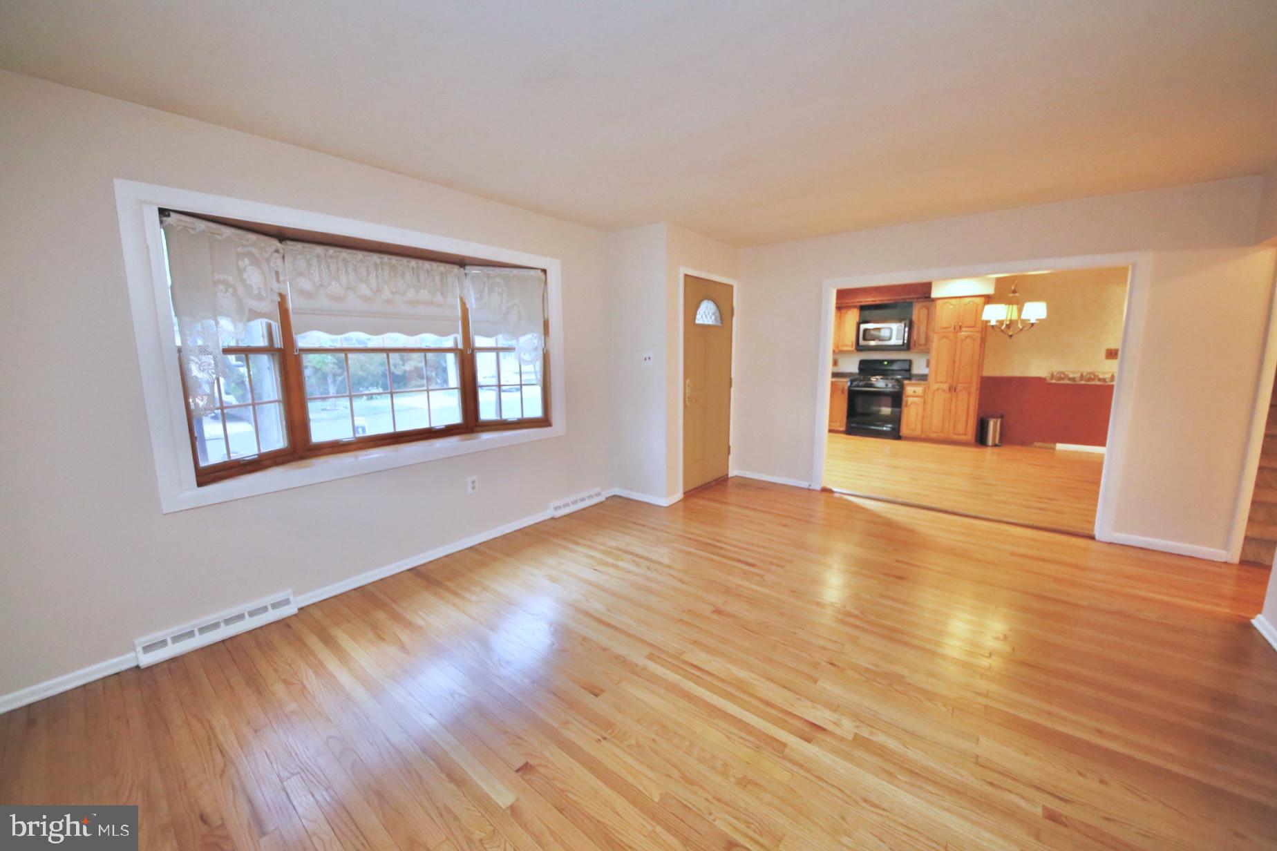 1017 West Front Street Glendora, NJ 08029 - Photo 7 of 34 Living room with redone hardwood flooring.
