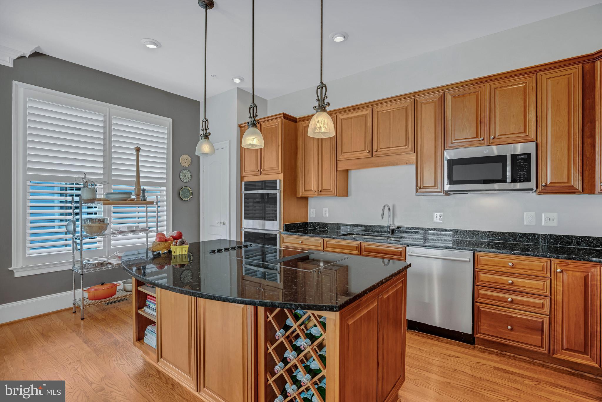 708 Day Lane Alexandria, VA 22314 - Photo 11 of 39 a kitchen with stainless steel appliances granite countertop a sink stove and cabinets