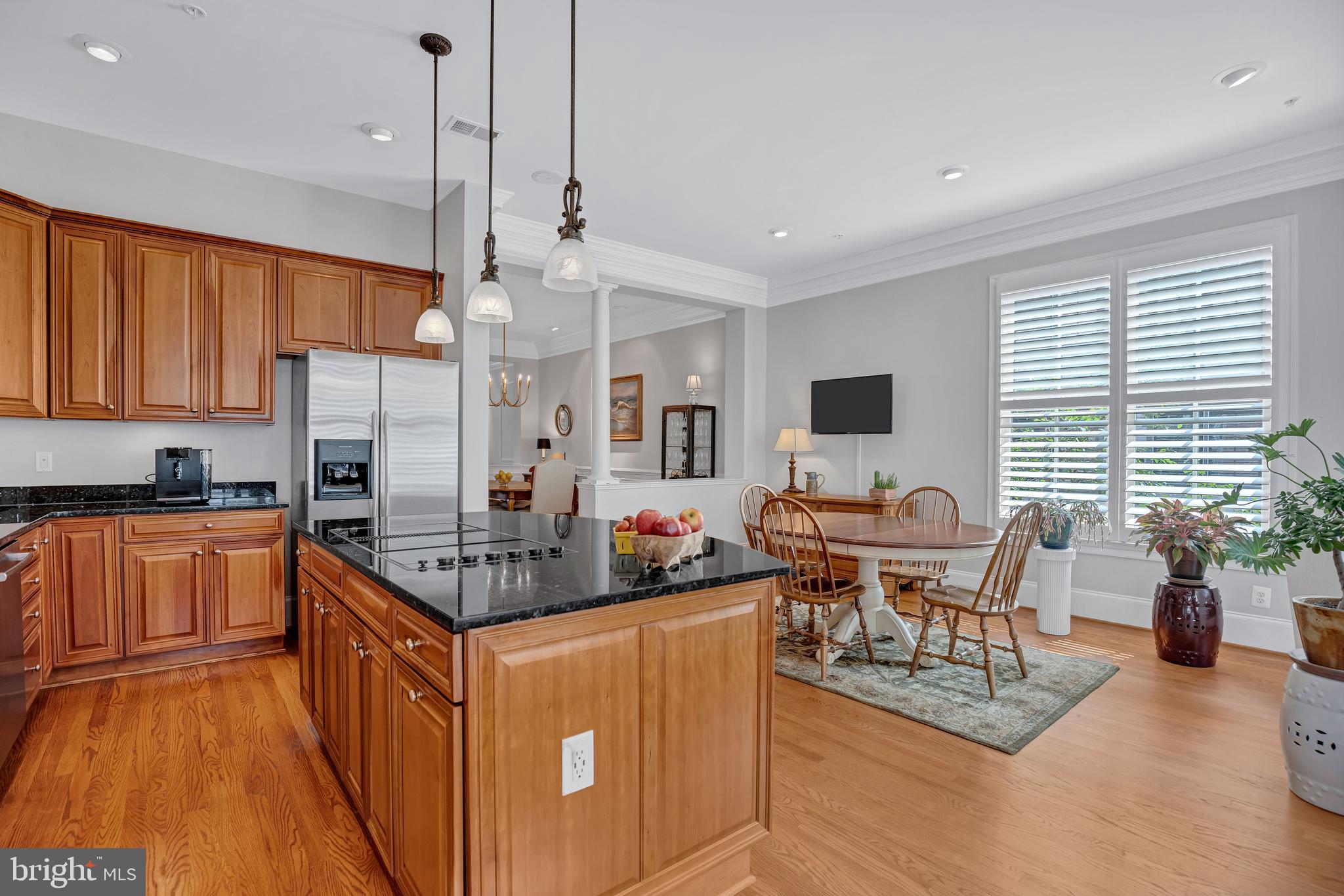 708 Day Lane Alexandria, VA 22314 - Photo 15 of 39 a kitchen with stainless steel appliances granite countertop a stove top oven a sink dishwasher and a dining table with the kitchen view