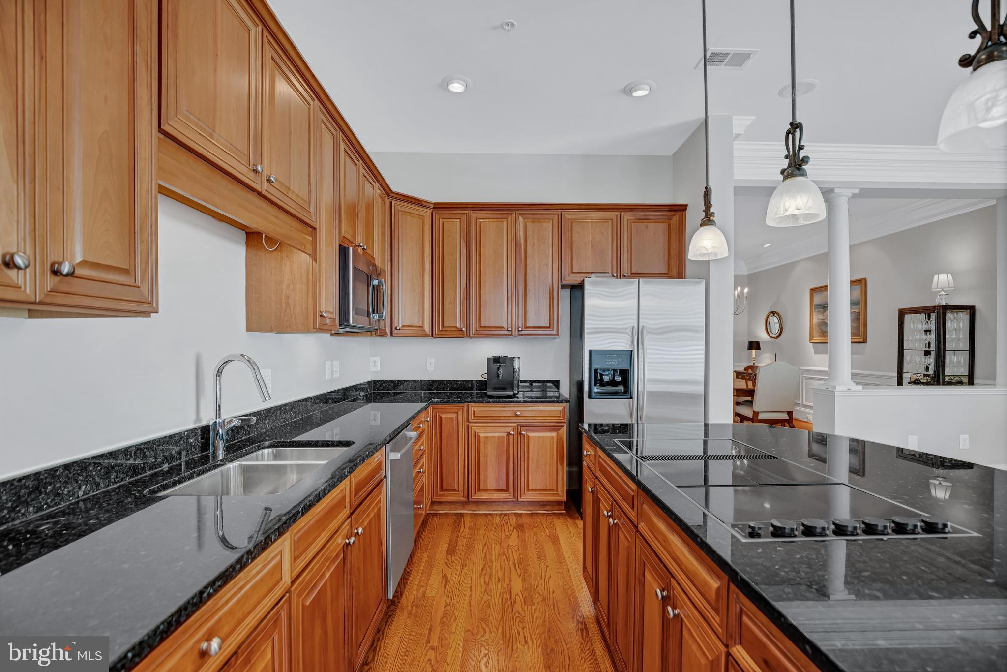 708 Day Lane Alexandria, VA 22314 - Photo 16 of 39 a kitchen with granite countertop a sink a counter space appliances and cabinets