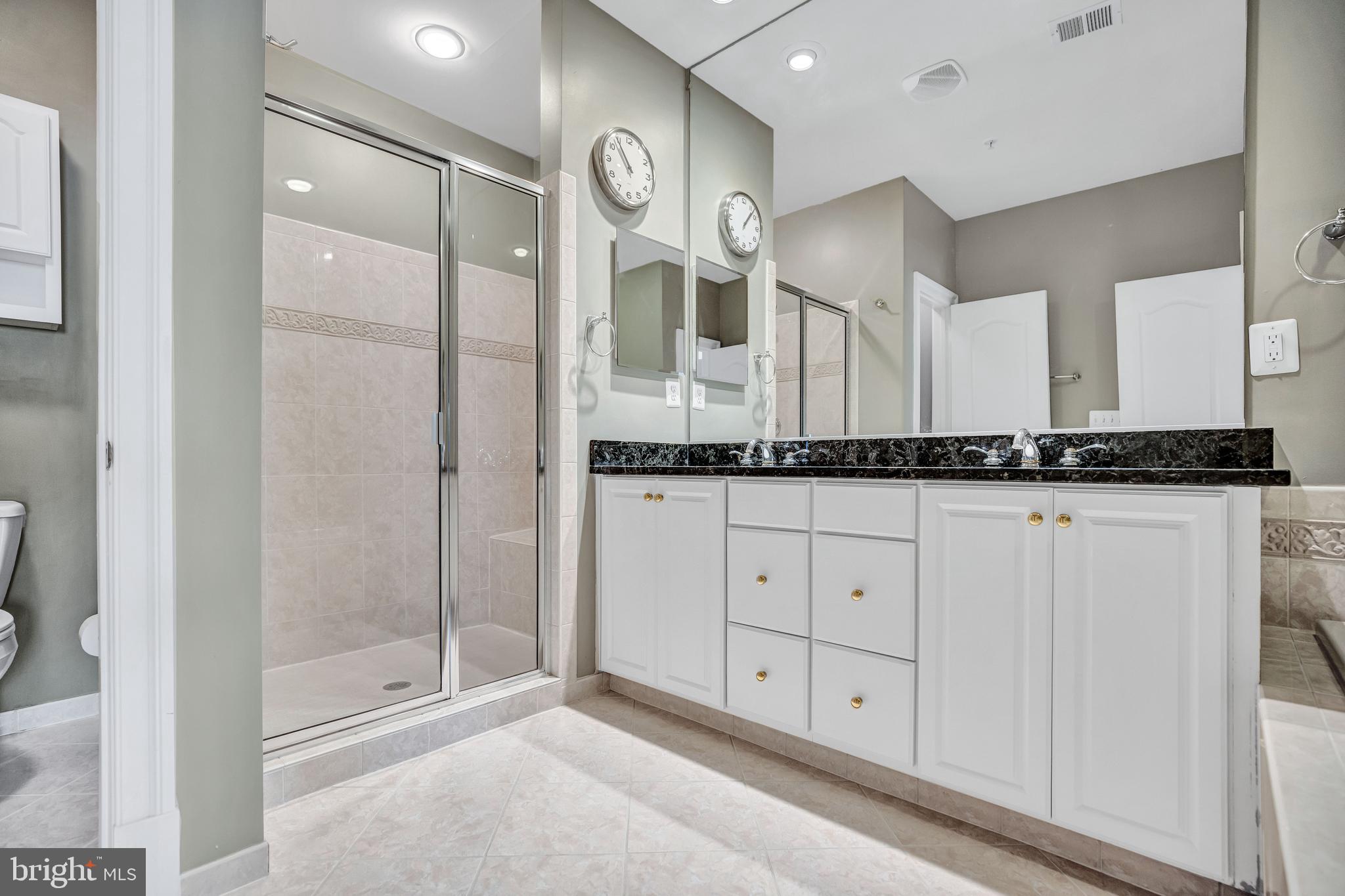 708 Day Lane Alexandria, VA 22314 - Photo 25 of 39 a bathroom with a granite countertop sink and a mirror