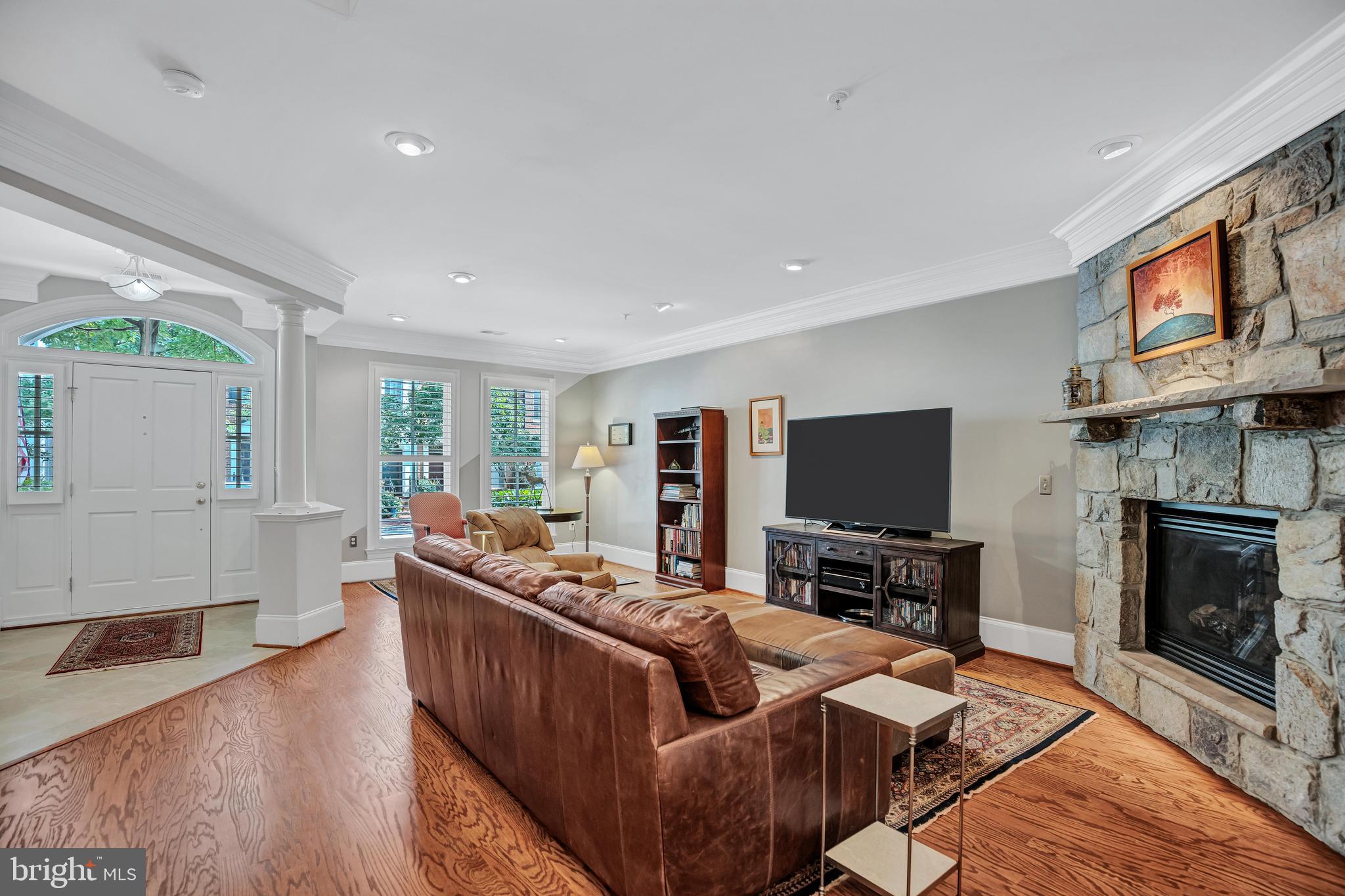 708 Day Lane Alexandria, VA 22314 - Photo 6 of 39 a living room with fireplace furniture and a flat screen tv