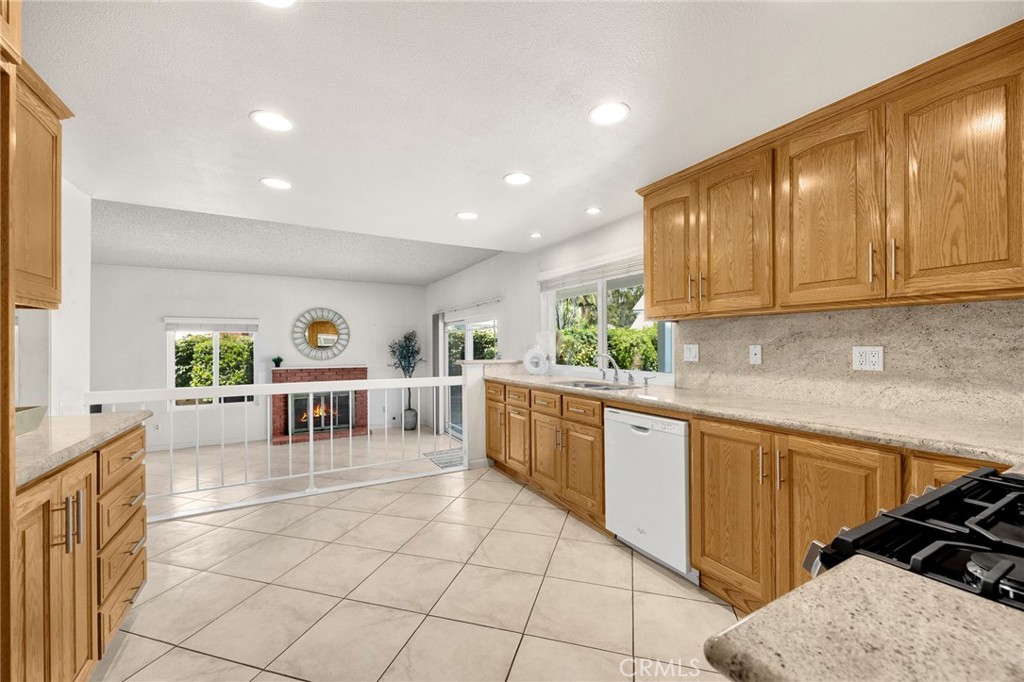 1342 Beechwood Drive Brea, CA 92821 - Photo 14 of 43 a kitchen with stainless steel appliances granite countertop a sink and cabinets