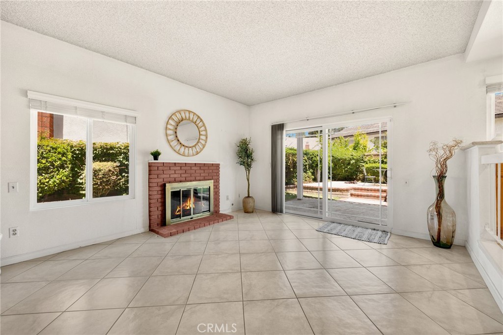 1342 Beechwood Drive Brea, CA 92821 - Photo 20 of 43 a view of an empty room with a fireplace and a window