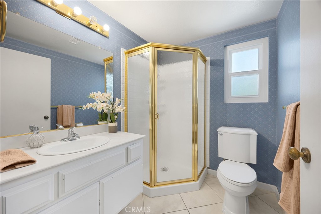 1342 Beechwood Drive Brea, CA 92821 - Photo 23 of 43 a bathroom with a toilet sink and mirror