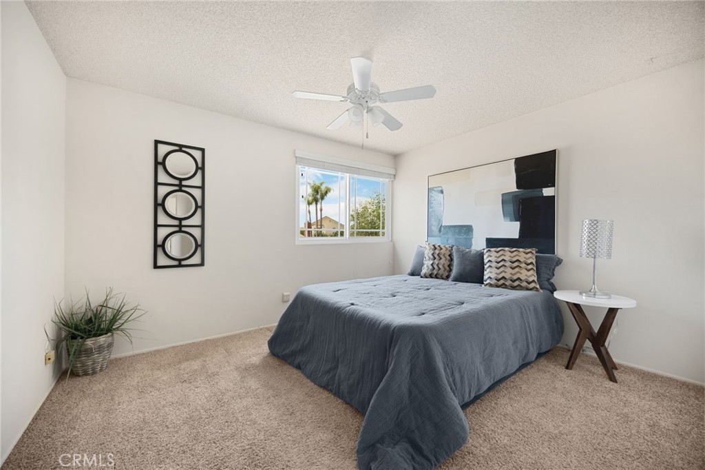 1342 Beechwood Drive Brea, CA 92821 - Photo 25 of 43 a bedroom with a large bed and a chandelier