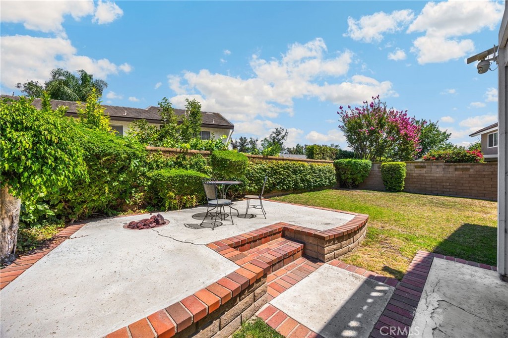 1342 Beechwood Drive Brea, CA 92821 - Photo 38 of 43 a view of a patio with table and chairs potted plants with wooden floor