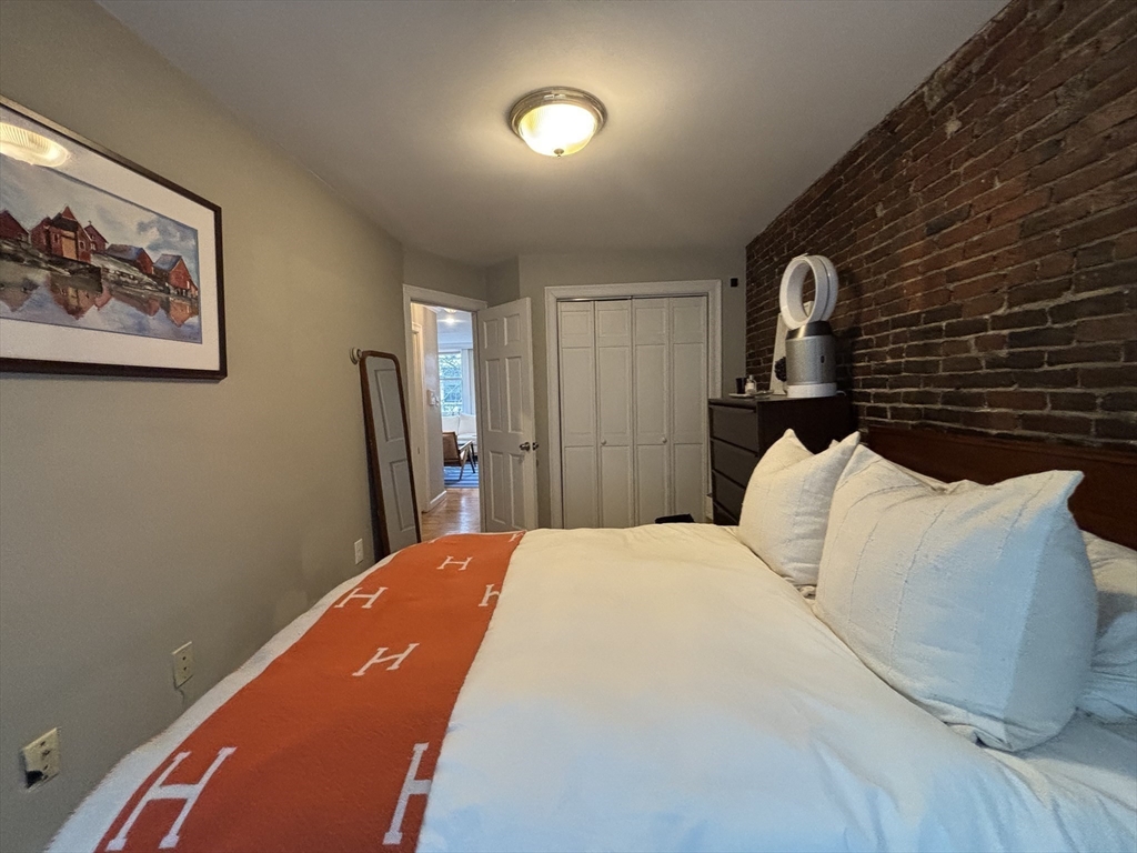 41 Grove Boston Ma, Unit 4 Boston, MA 02114 - Photo 15 of 20 a bedroom with a bed and a lamp