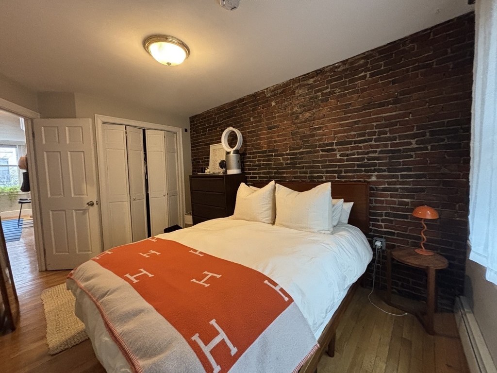 41 Grove Boston Ma, Unit 4 Boston, MA 02114 - Photo 17 of 20 a bed room with a bed and a chair