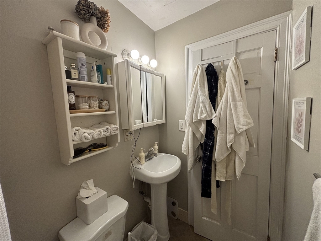 41 Grove Boston Ma, Unit 4 Boston, MA 02114 - Photo 20 of 20 a bathroom with a sink toilet and mirror