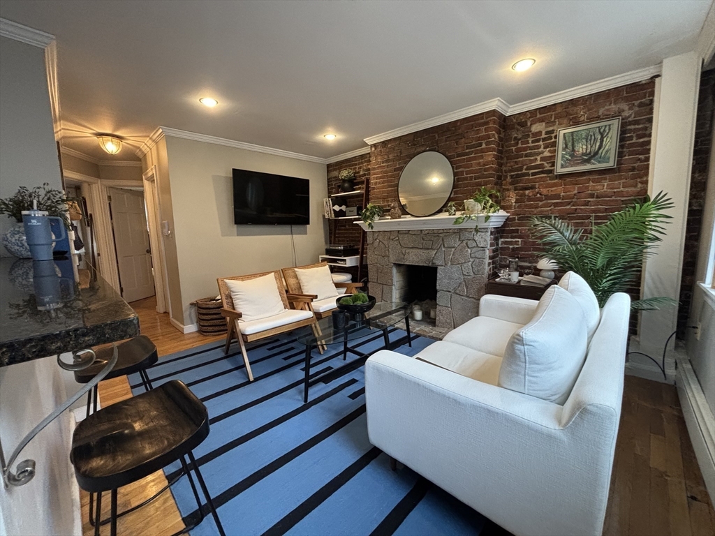 41 Grove Boston Ma, Unit 4 Boston, MA 02114 - Photo 3 of 20 a living room with furniture and a fireplace