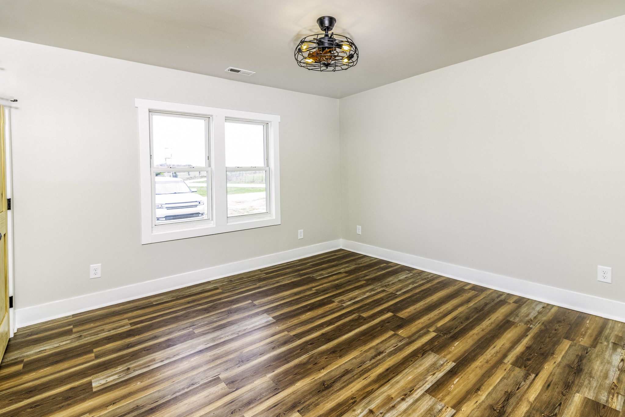 2081 Fall River Road Leoma, TN 38468 - Photo 12 of 15 a view of an empty room with wooden floor and a window