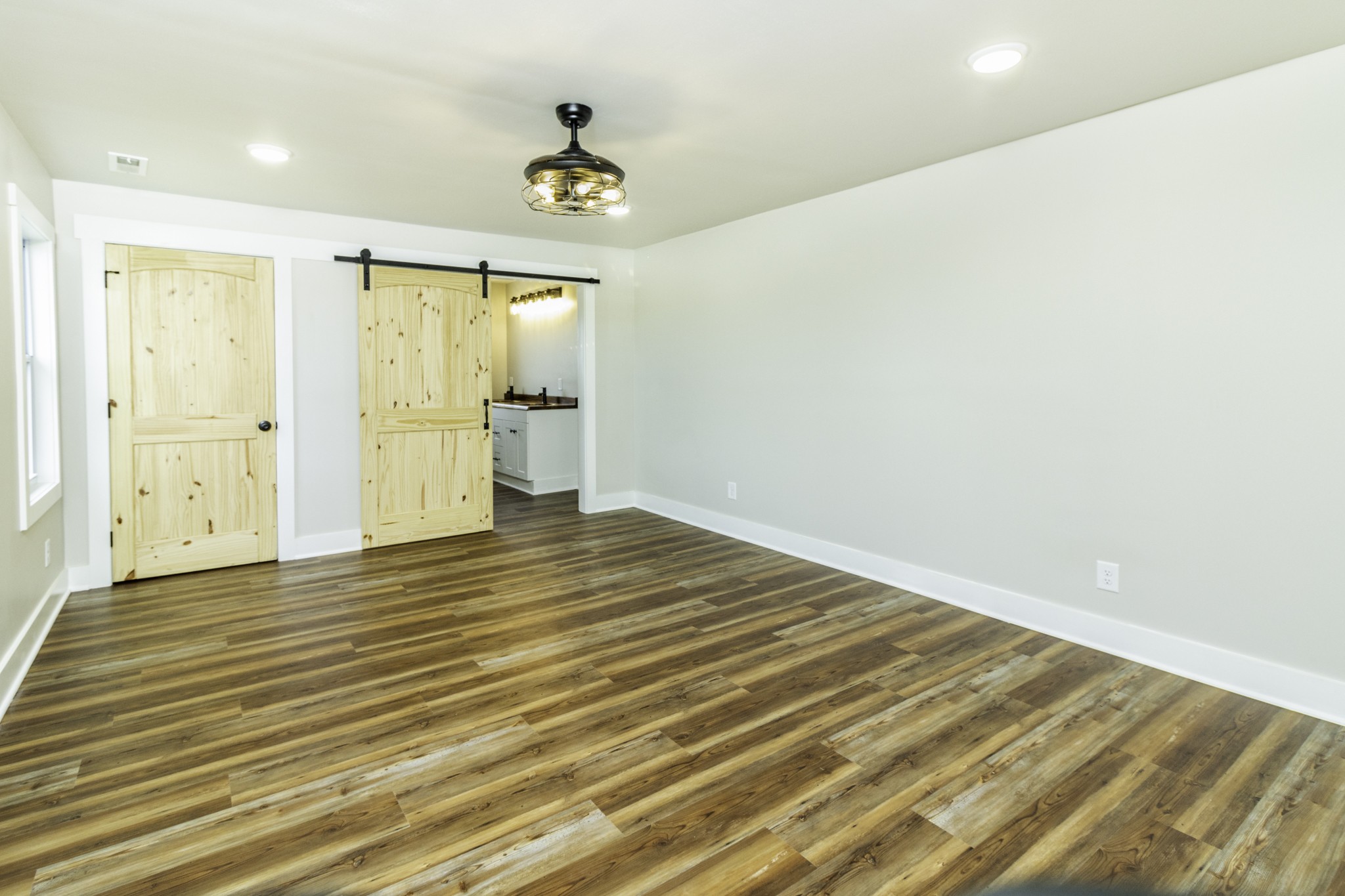 2081 Fall River Road Leoma, TN 38468 - Photo 10 of 15 a view of an empty room with wooden floor and a window