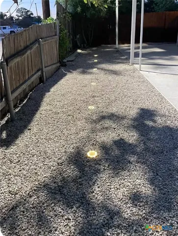 a view of a house with a yard porch and sitting area