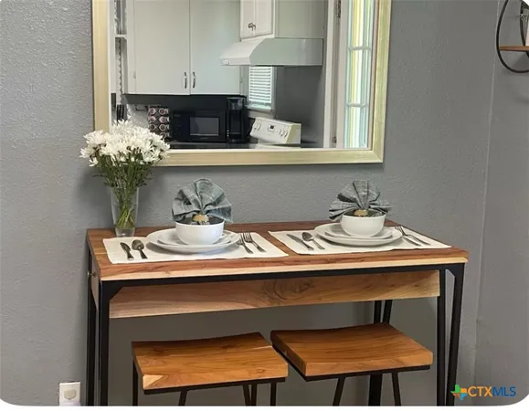 a close view of a sink and cabinets