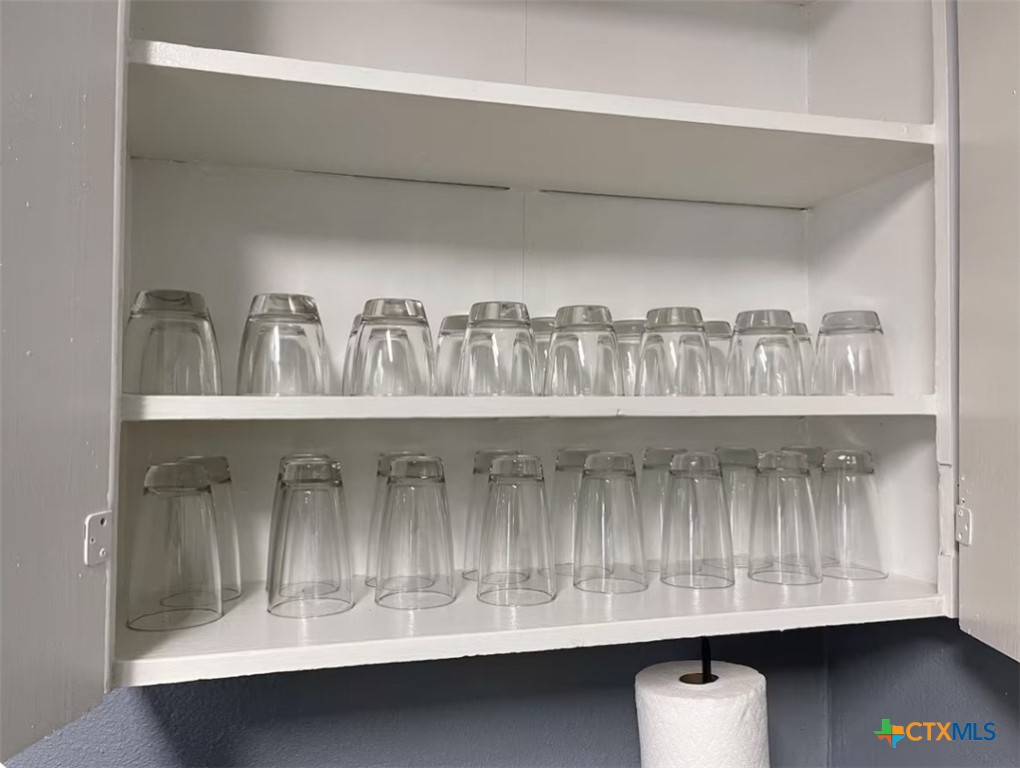 284 Perryman Street New Braunfels, TX 78130 - Photo 10 of 41 a kitchen with a sink and cabinets