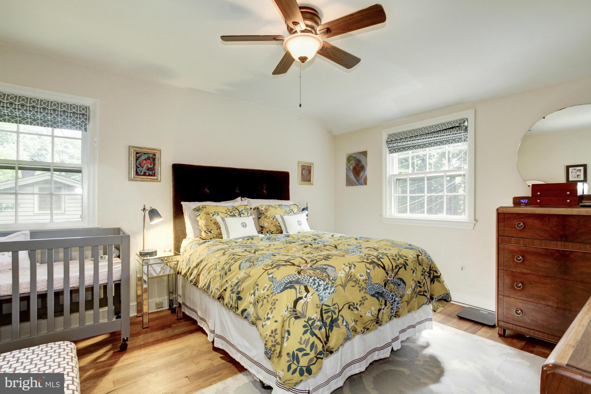 9917 Big Rock Road Silver Spring, MD 20901 - Photo 12 of 24 a bedroom with a bed and a dresser