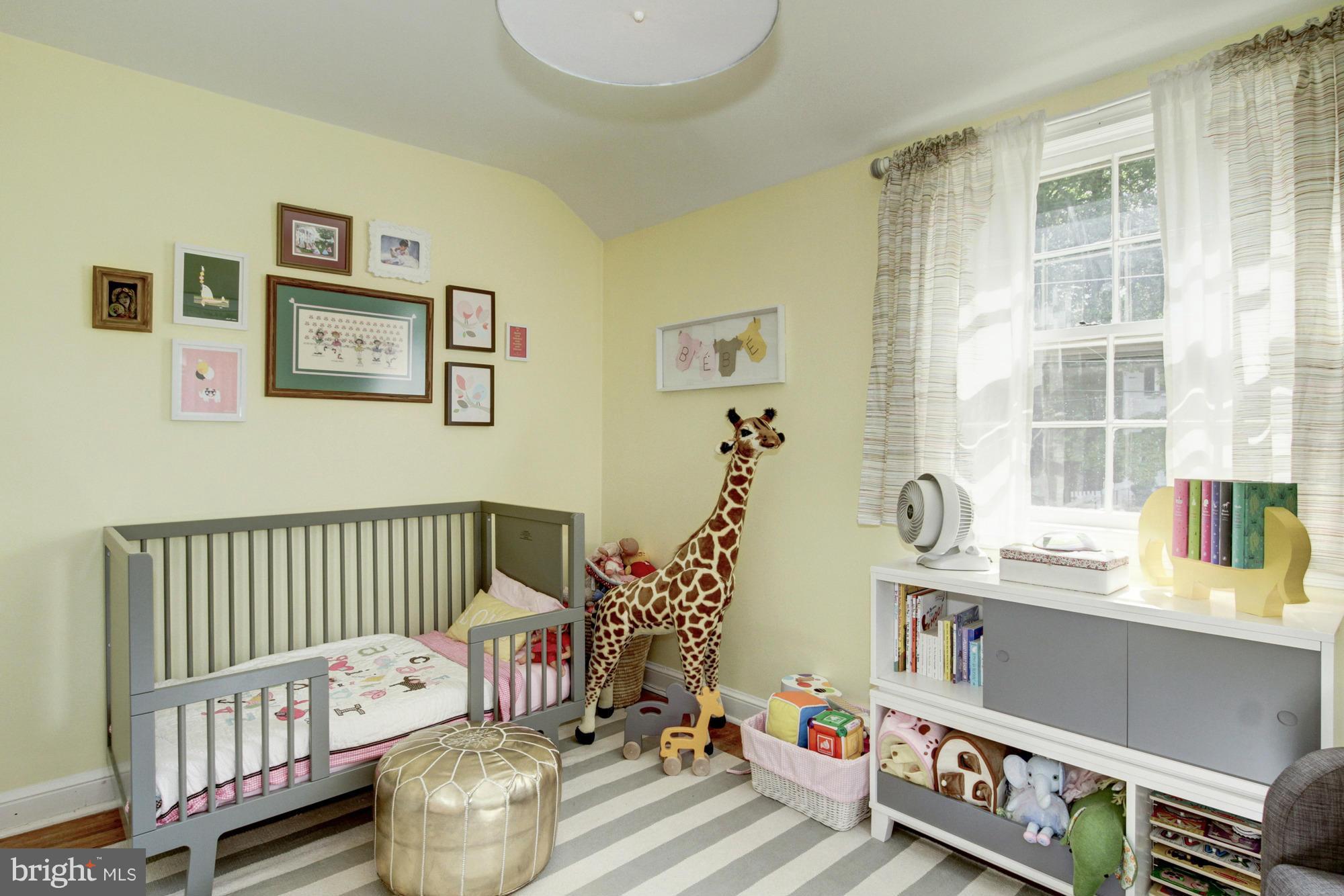 9917 Big Rock Road Silver Spring, MD 20901 - Photo 15 of 24 a bedroom with furniture and a window